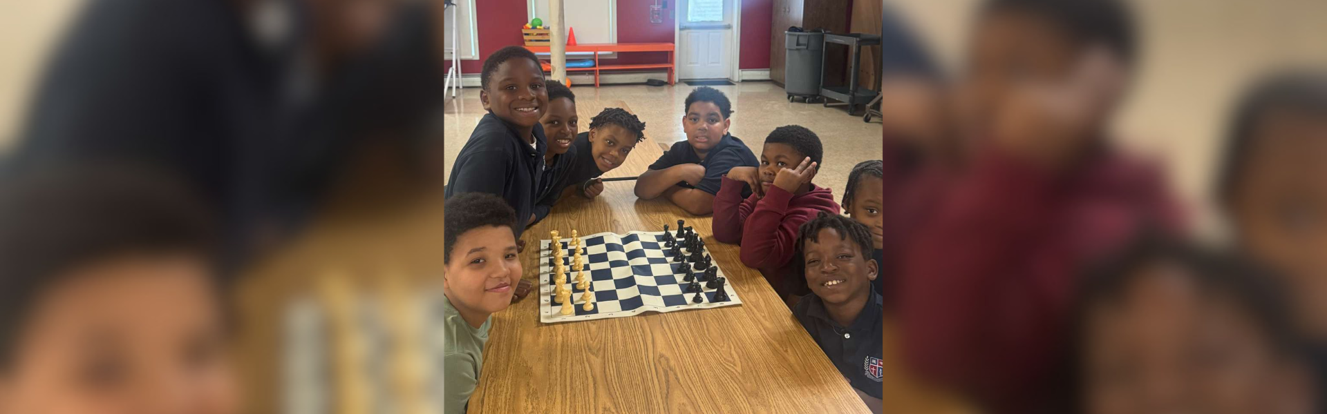 group of boys are playing chess